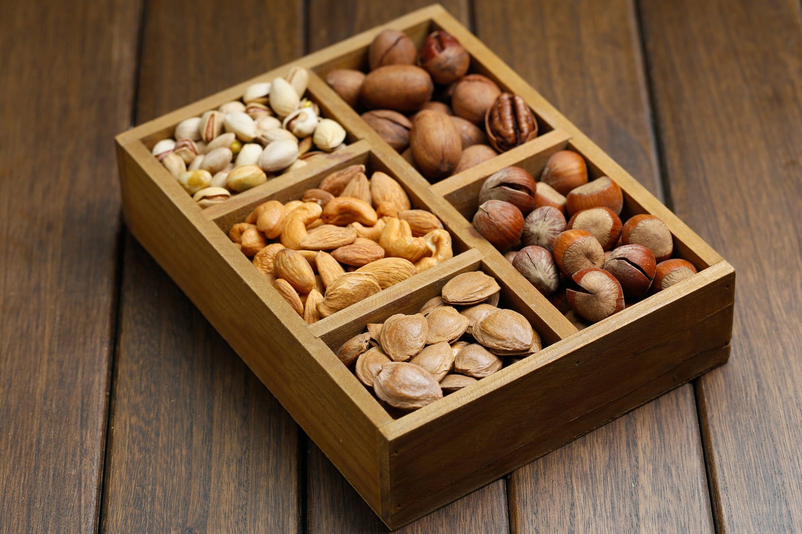 various nuts wooden box scaled